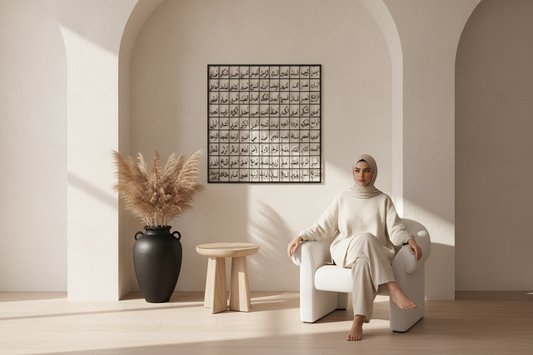Woman sitting in a modern, minimalistic room with a vase and abstract art on the wall.