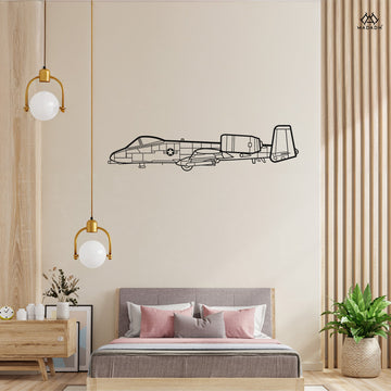 Laser-cut A-10 Thunderbolt II metal wall art silhouette mounted on a modern living room wall