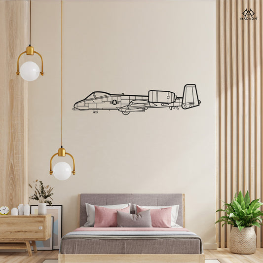 Laser-cut A-10 Thunderbolt II metal wall art silhouette mounted on a modern living room wall
