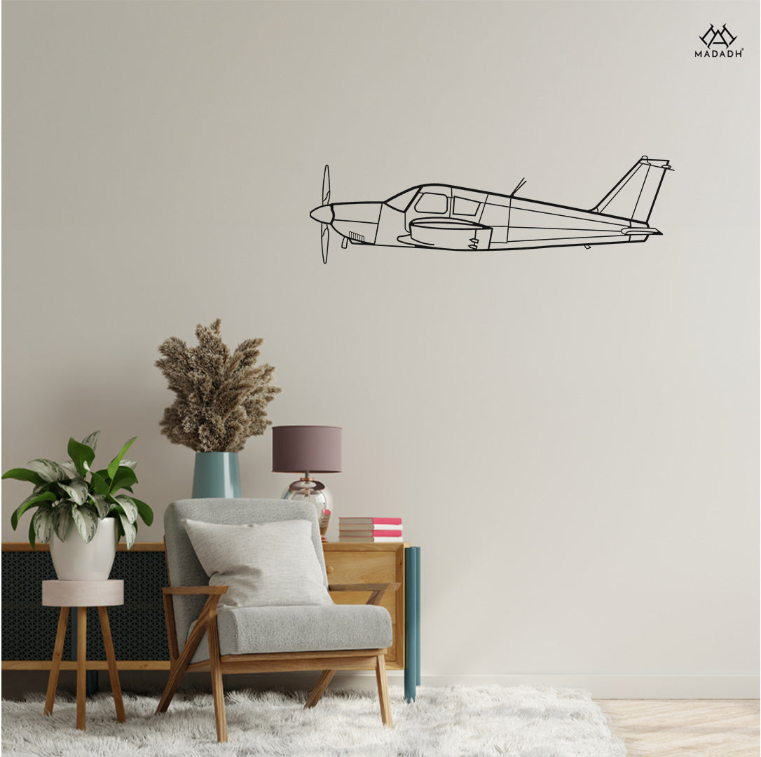 Close-up of precision-cut PA-28 Cherokee airplane silhouette décor